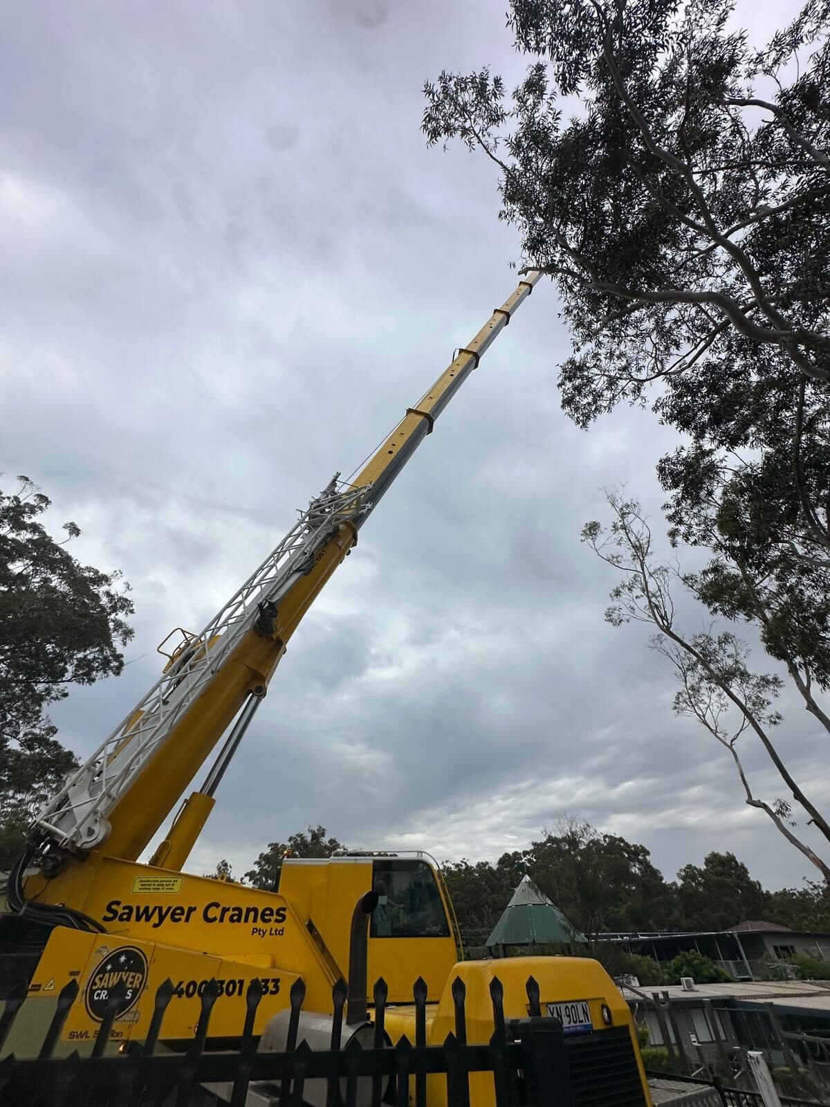 Crane boom extended above the grounds in Gymea.